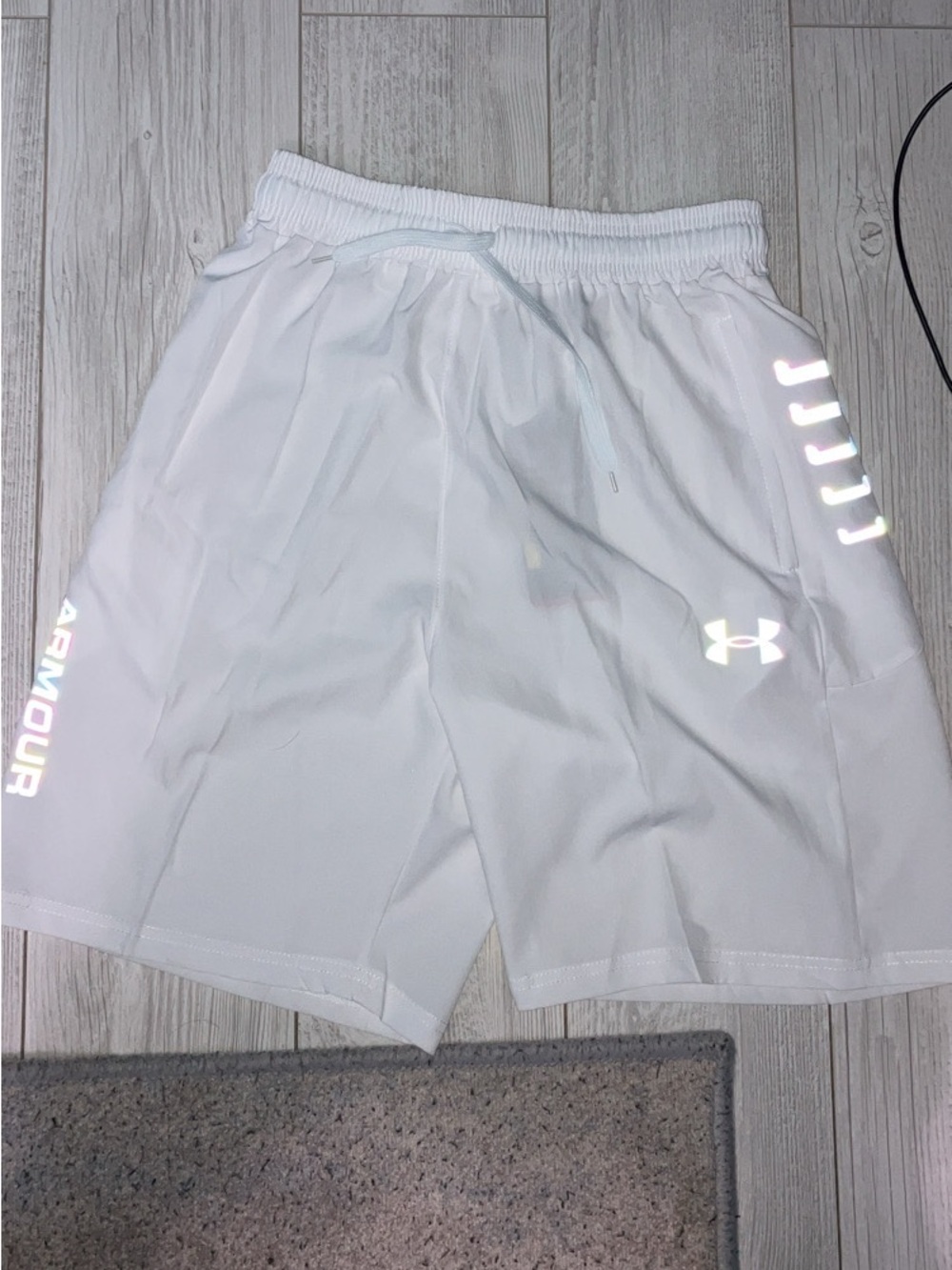 White under armour size medium rainbow reflective shorts. Size m